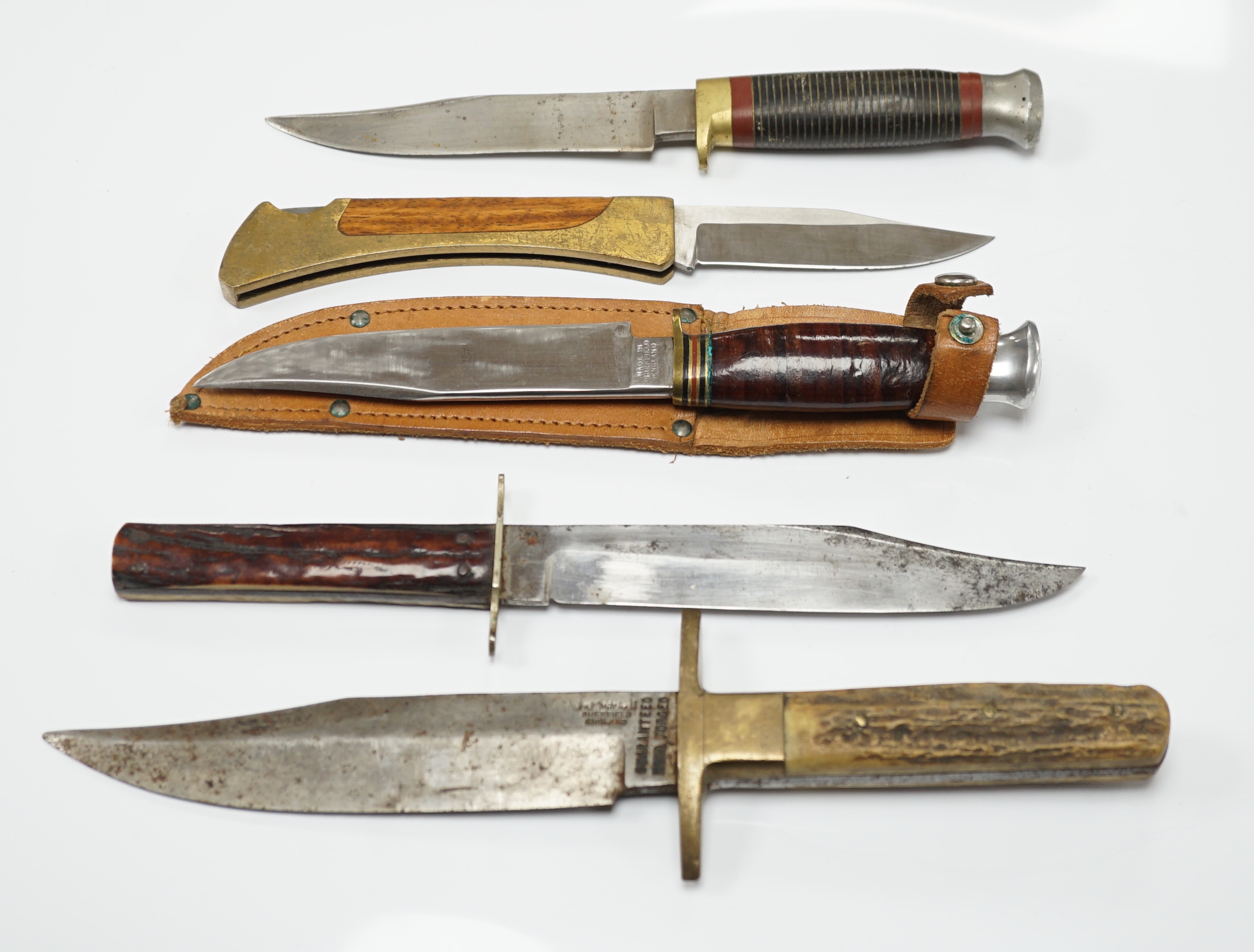 Two antler-handled hunting knives and three other knives